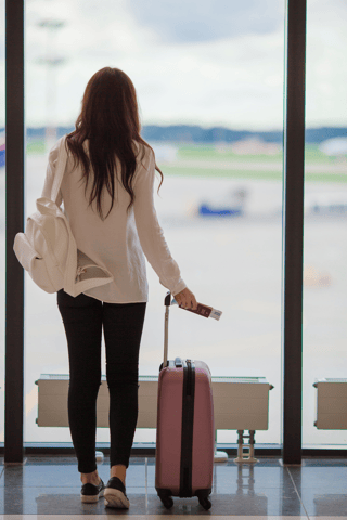 A Woman Waiting For Her Flight