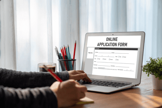Person filling out an online application form