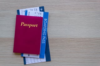 Passport and boarding pass on wood table